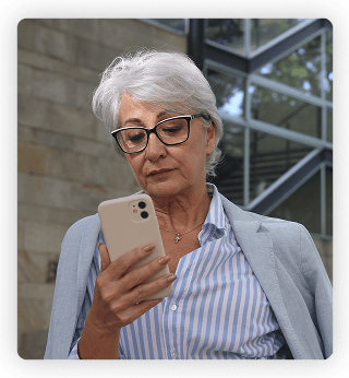 an older woman looking at her ohone