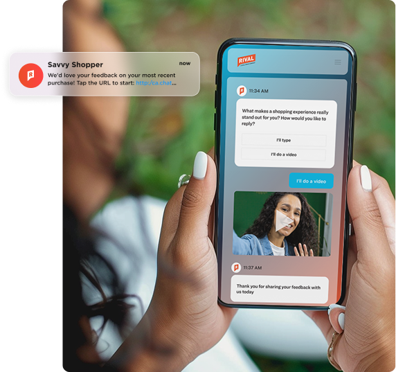 A person holding a smartphone displaying a chat-style survey interface branded 'Rival.' The screen shows a question asking what makes a shopping experience stand out, with options to respond by typing or video — with 'I'll do a video' selected in blue. A video response thumbnail is visible mid-conversation. A push notification from 'Savvy Shopper' appears in the upper left, requesting purchase feedback