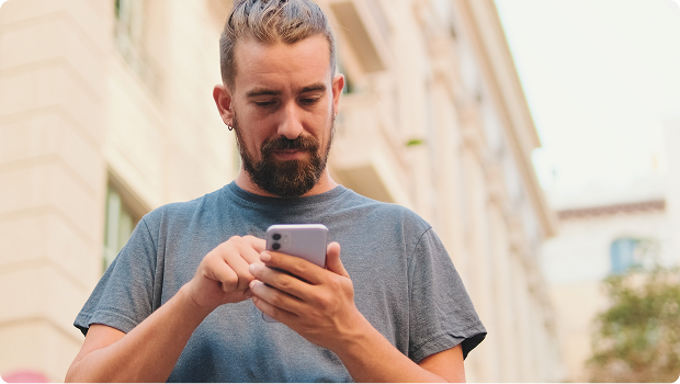 man-using-mobile-phone-in-city
